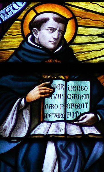 a monk holds a book